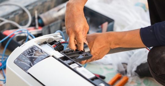 Homeowner trying to repair their own air conditioner.